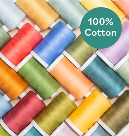 A collection of colorful spools of thread. 100% Cotton