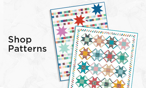 Text: Shop Patterns: quilt patterns on a neutral marble background