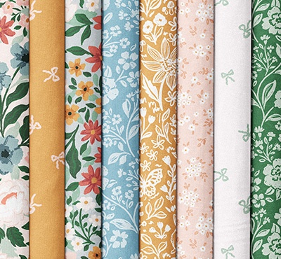 Floral and bow quilting fabrics in varying colors. >>