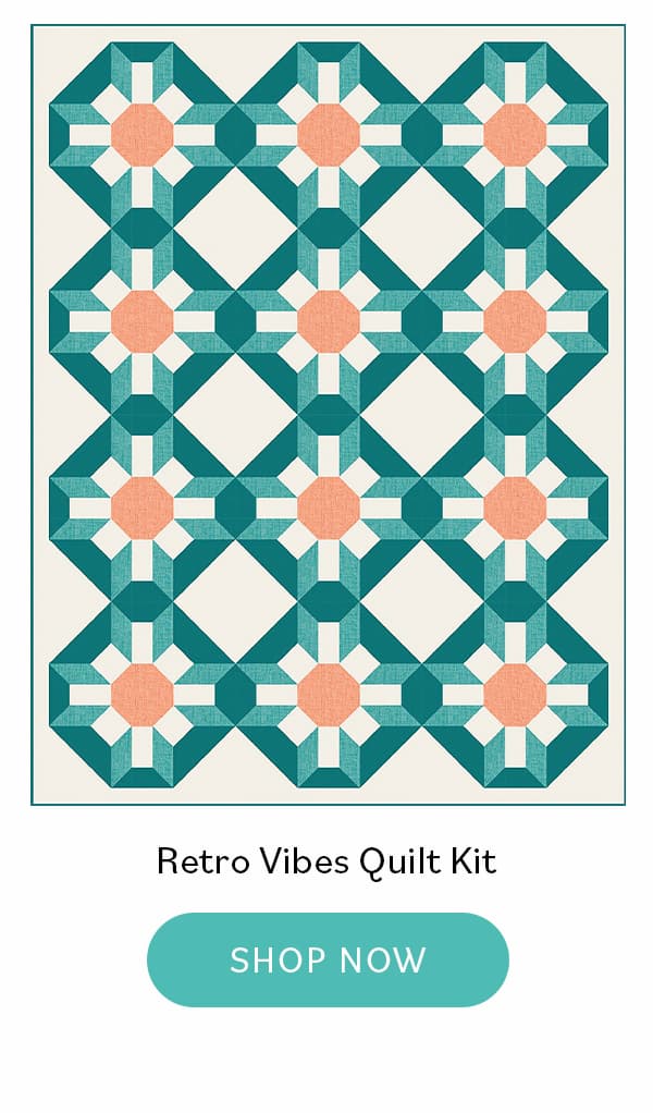 Image: A large retro themed quilt with green, cream, and coral floral blocks. Text: Retro Vibes Quilt Kit. Shop Now >>