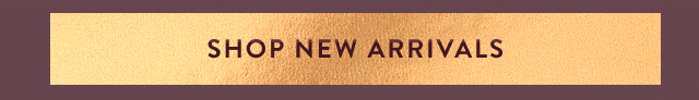 an image of a gold sign that says shop new arrivals