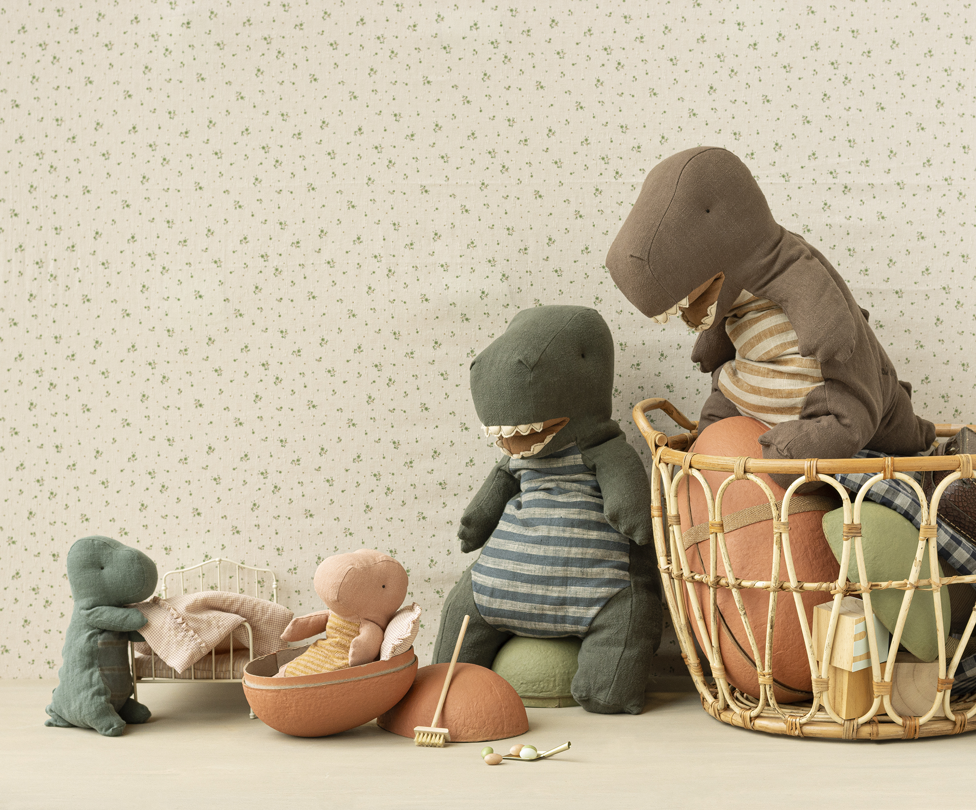 Maileg Dinosaurs big and small in child's playroom.