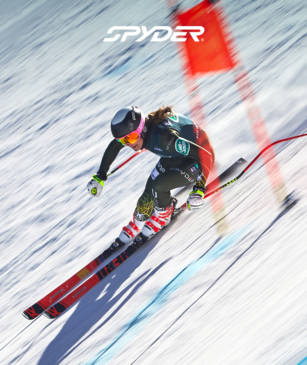 Spyder logo. Image of downhill ski racer.