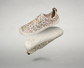Image of 4 products: A light blue fabric Wildling minimalist shoe, a cream-colored Wildling minimalist shoe with a light, abstract leopard-style pattern a beige Wildling minimalist shoe made of a textured natural fabric and a  light green fabric Wildling