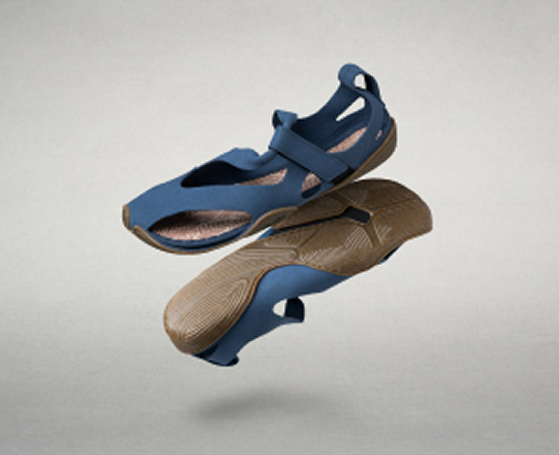 Product view of the Wildling sandals: One model entirely in black and one model in lilac, floating against a gray background.
