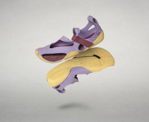 Product view of the Wildling sandals: One model entirely in black and one model in lilac, floating against a gray background.