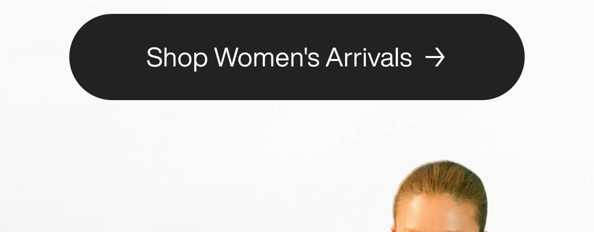Close-up of a button with the text "Shop Women's Arrivals" and an arrow, featuring the top of a woman's head slightly visible below.