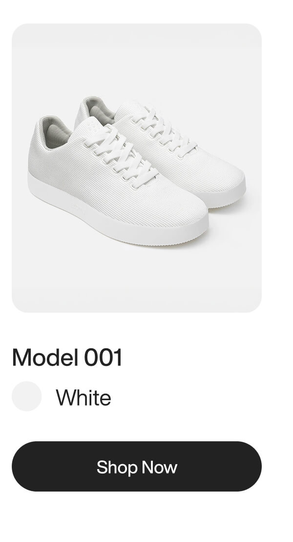 White sneakers, Model 001, displayed on a white background. Text reads "White" and "Shop Now" button is visible below.