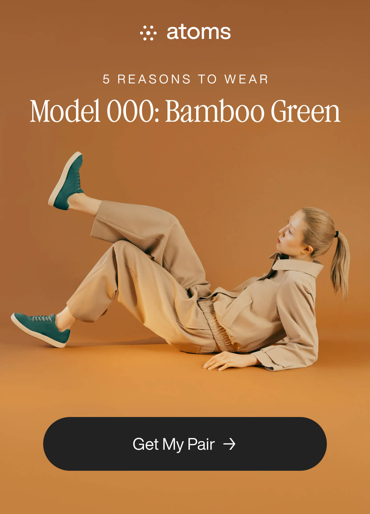 Model in beige outfit poses on brown backdrop, wearing Atoms Model 000 Bamboo Green sneakers. "Get My Pair" button below.