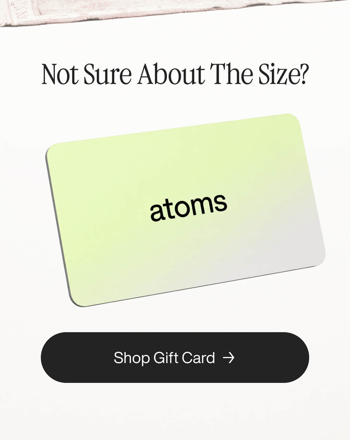 Gift card image with "atoms" text on a light green background. Above, “Not Sure About The Size?” text appears. Below, a "Shop Gift Card" button.