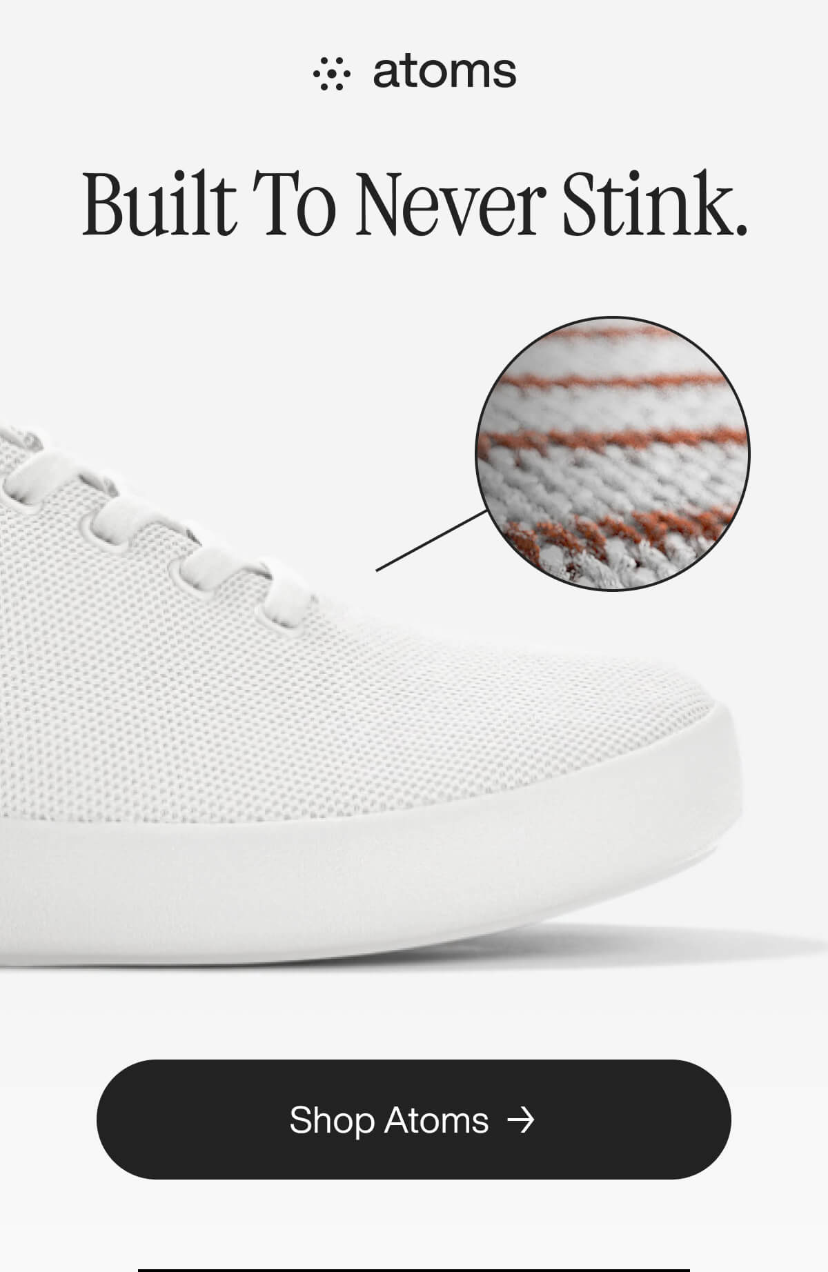 A white sneaker by Atoms is shown with a close-up of its breathable fabric. Text reads, "Built To Never Stink." Button below says, "Shop Atoms."