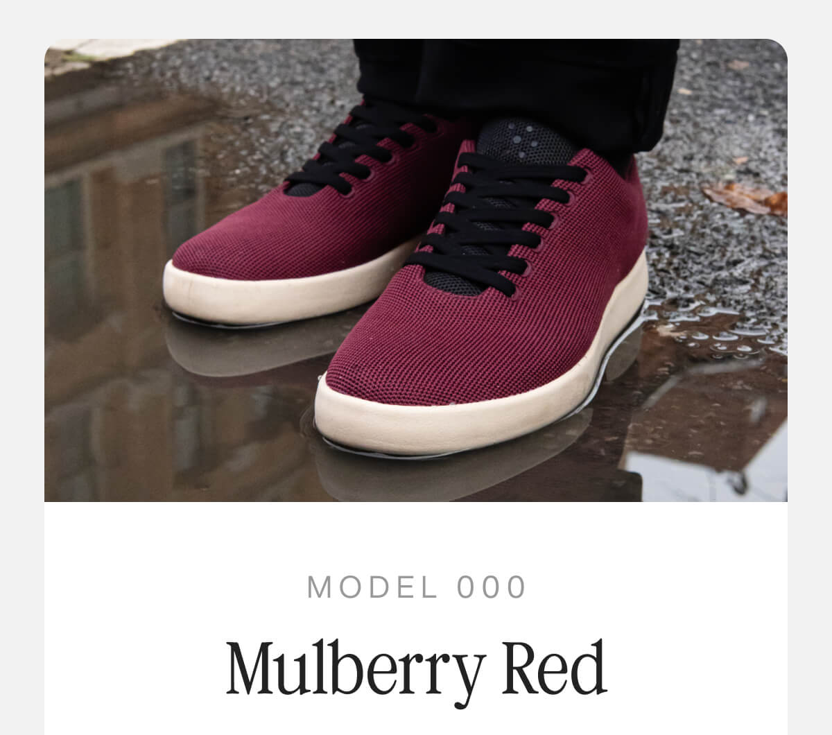 Image of the Model 000 in mulberry red, showcasing its sleek design and vibrant color.