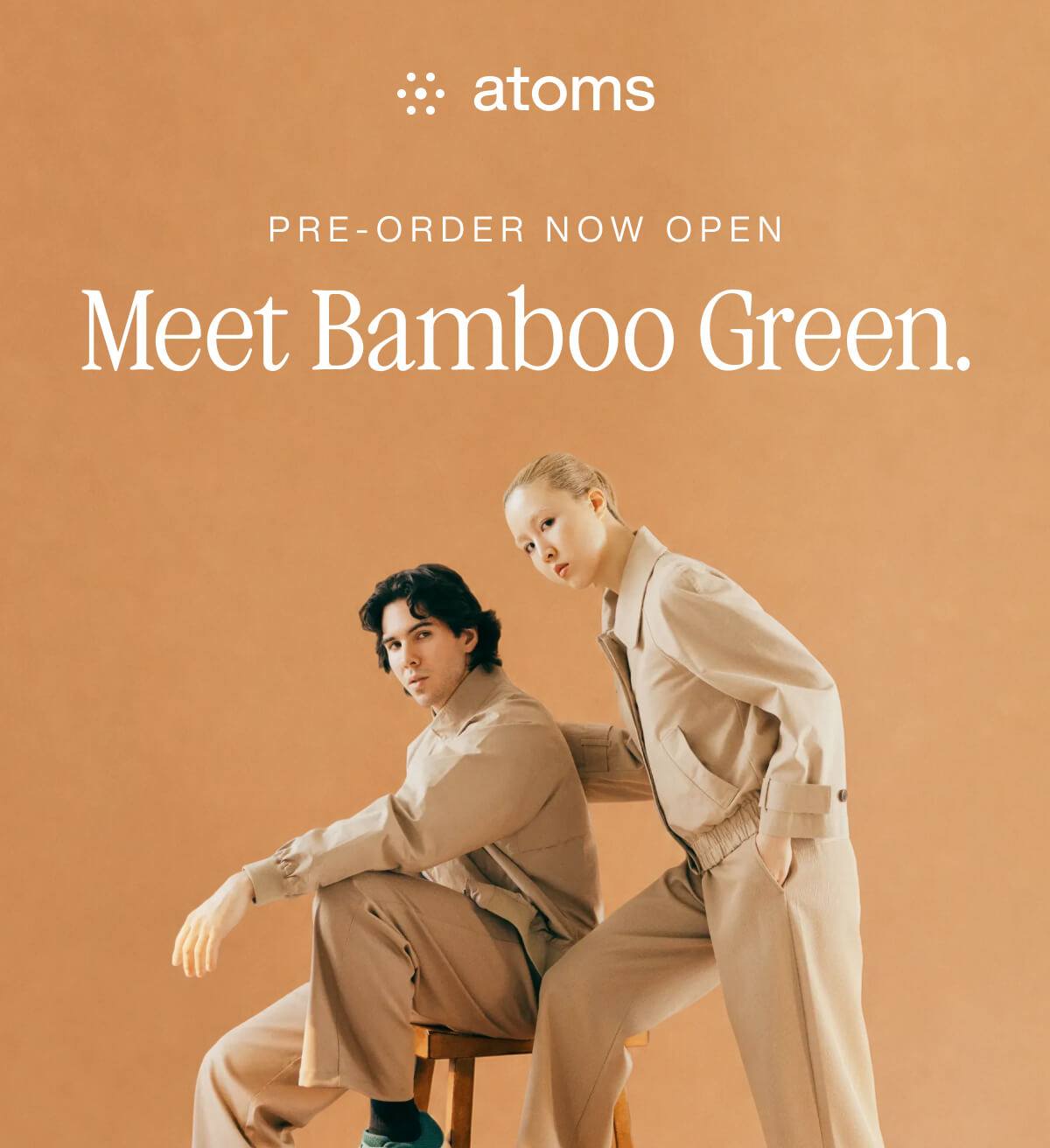 Two people in neutral-toned outfits pose against a warm beige background. Text above reads “Meet Bamboo Green." The mood is stylish and modern.