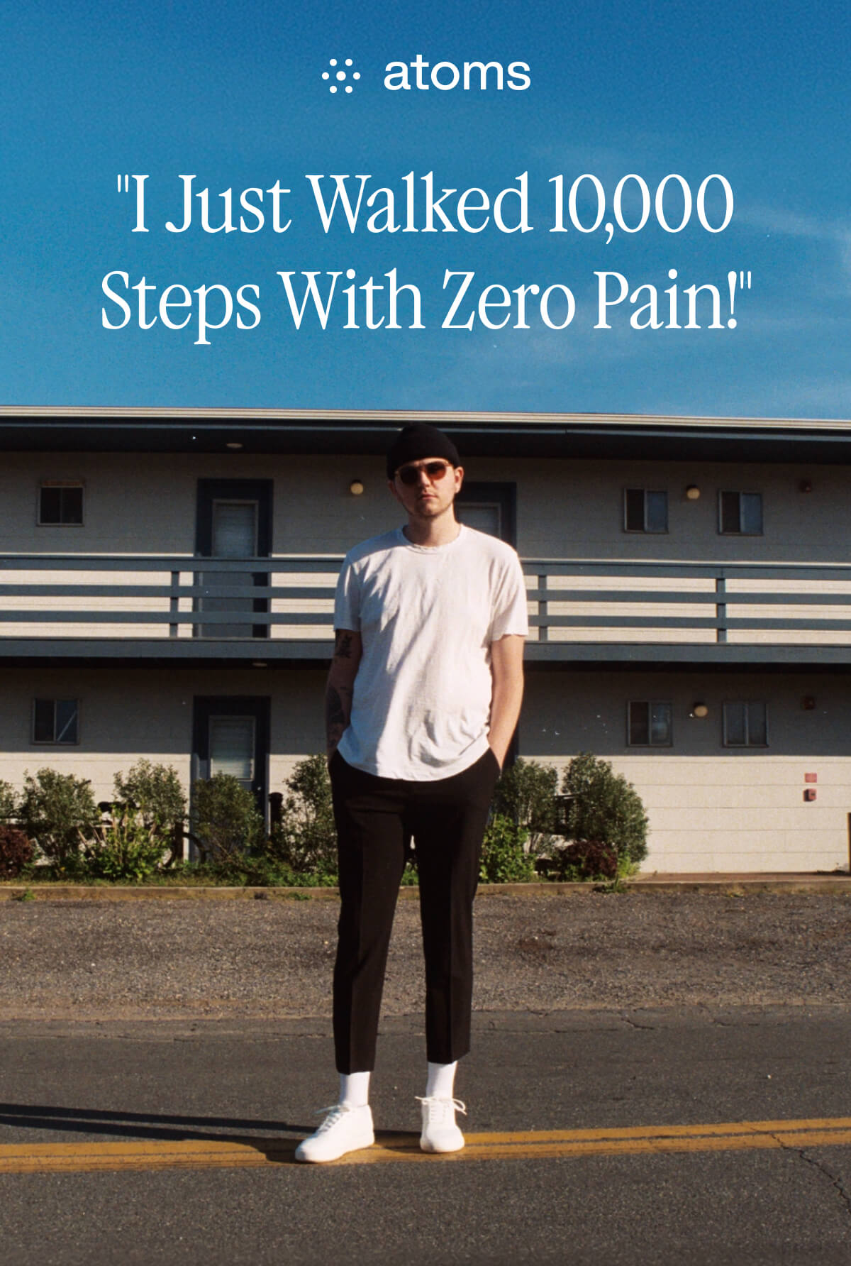 "Man in white shirt and black pants stands confidently on road. Text reads: "I Just Walked 10,000 Steps With Zero Pain!""