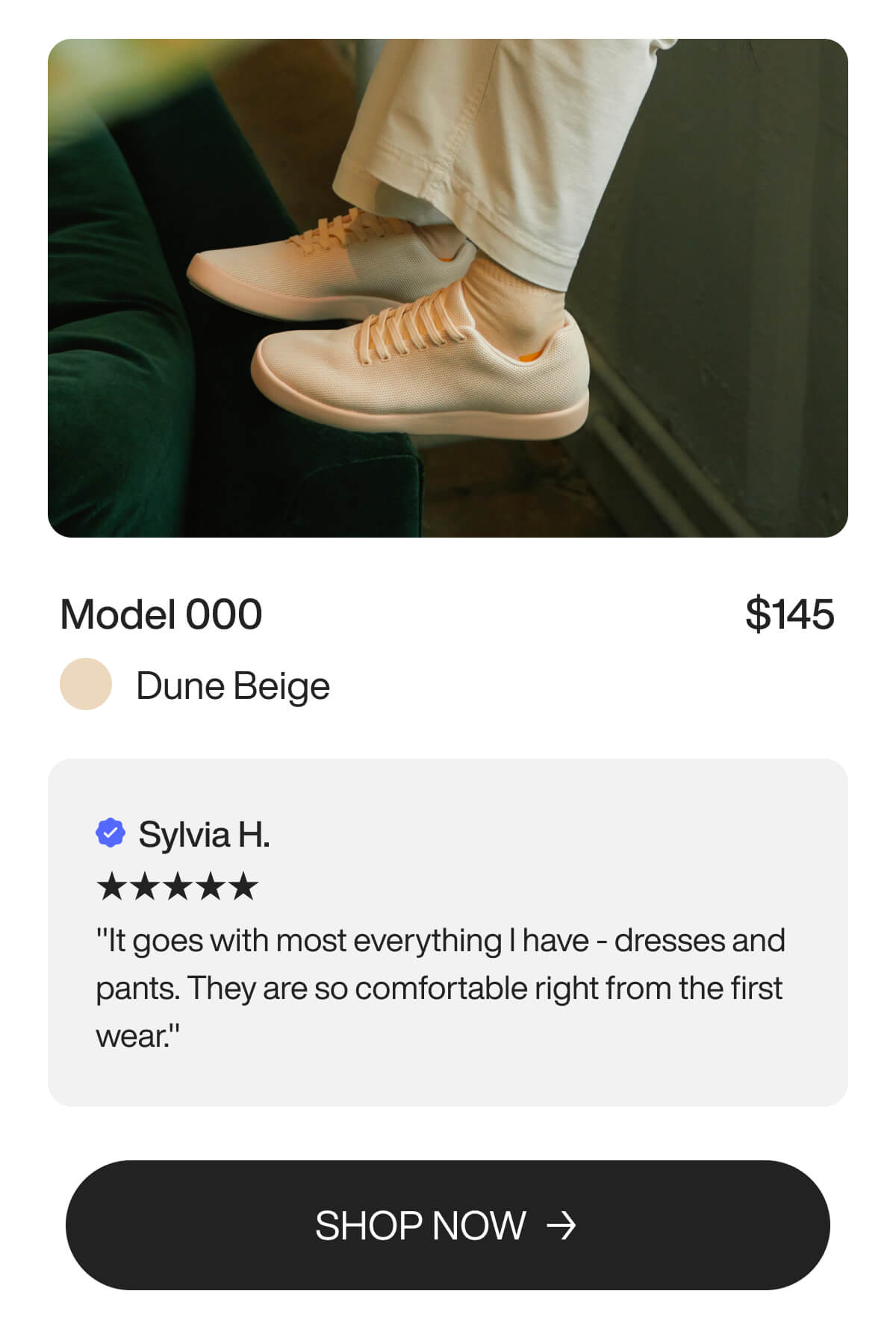 A pair of beige sneakers worn with off-white pants, positioned against a green couch. The text highlights the Model 000 sneakers priced at $145, in 'Dune Beige.' A five-star review by Sylvia H. praises their comfort and versatility. 'Shop Now' button included.