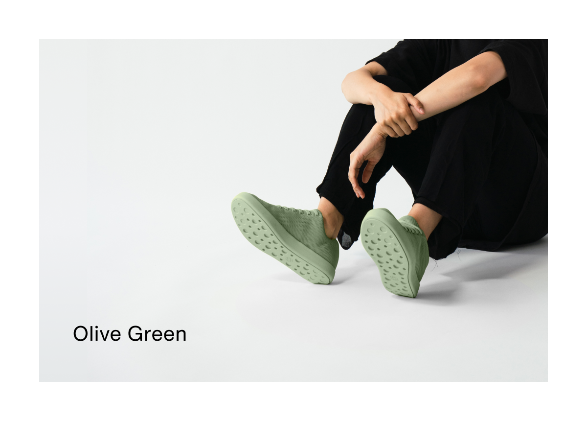 Olive Green. Lifestyle shot of a person wearing Olive Green shoes. 