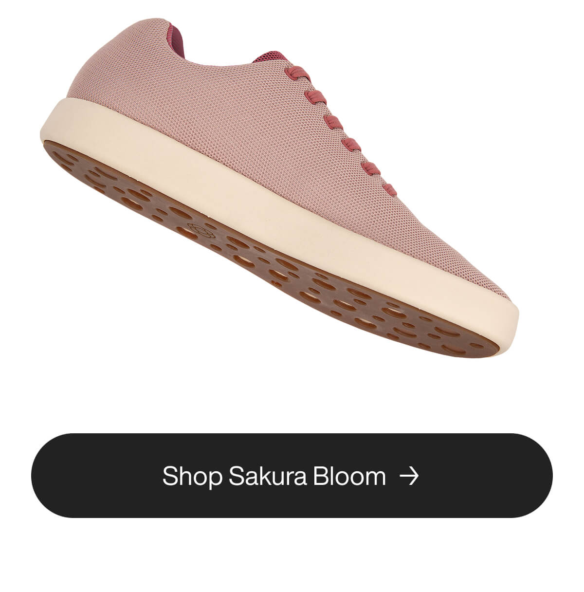 Pink sneaker with a textured surface, white sole, and brown grip underfoot. A button below reads "Shop Sakura Bloom" in a sleek, modern font.