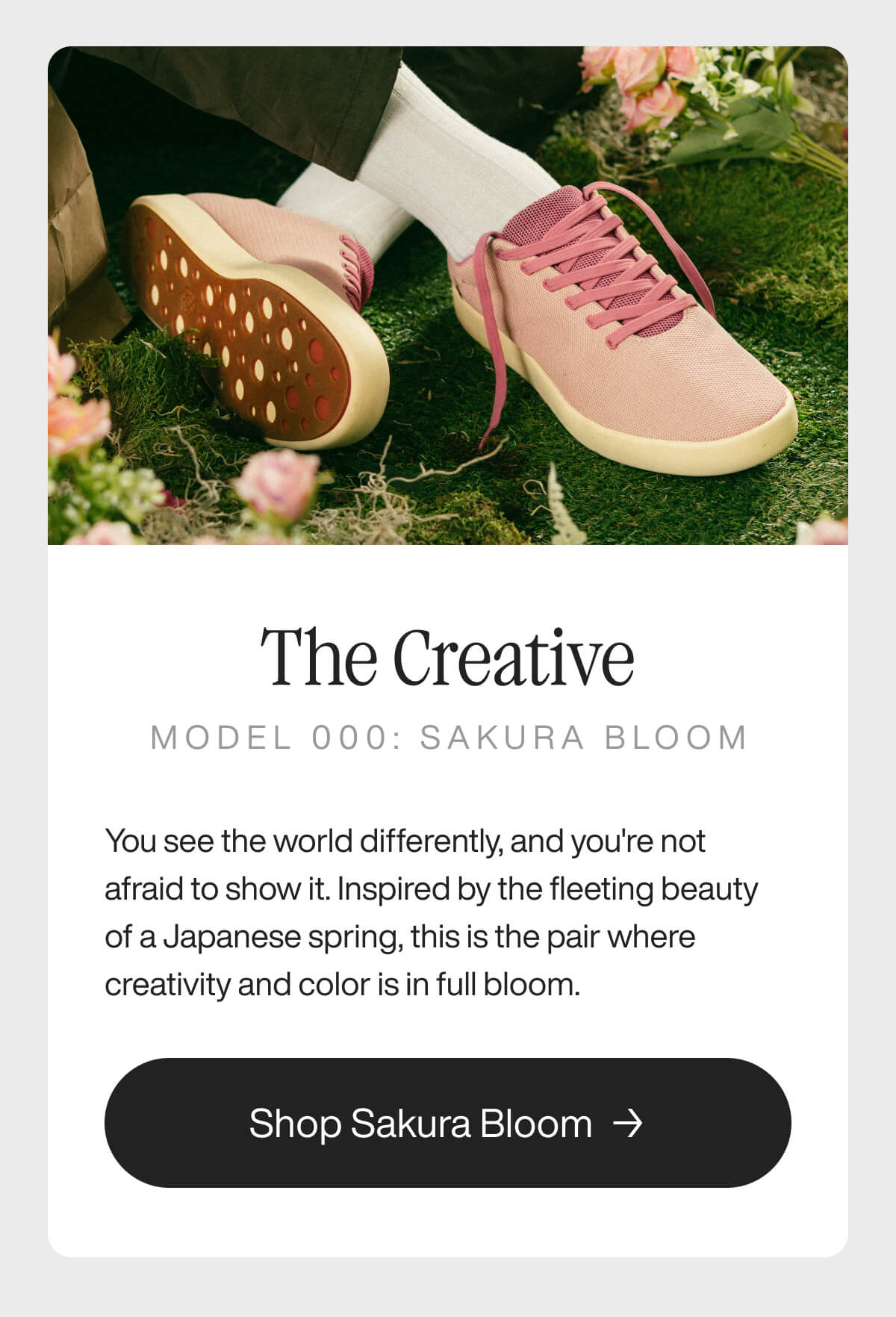 "Pink sneakers on grass with flowers, promoting "The Creative" Model 000: Sakura Bloom. Button reads "Shop Sakura Bloom.""