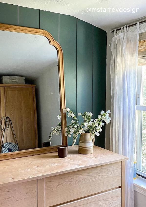 Bedroom featuring moody green paint color Current Mood