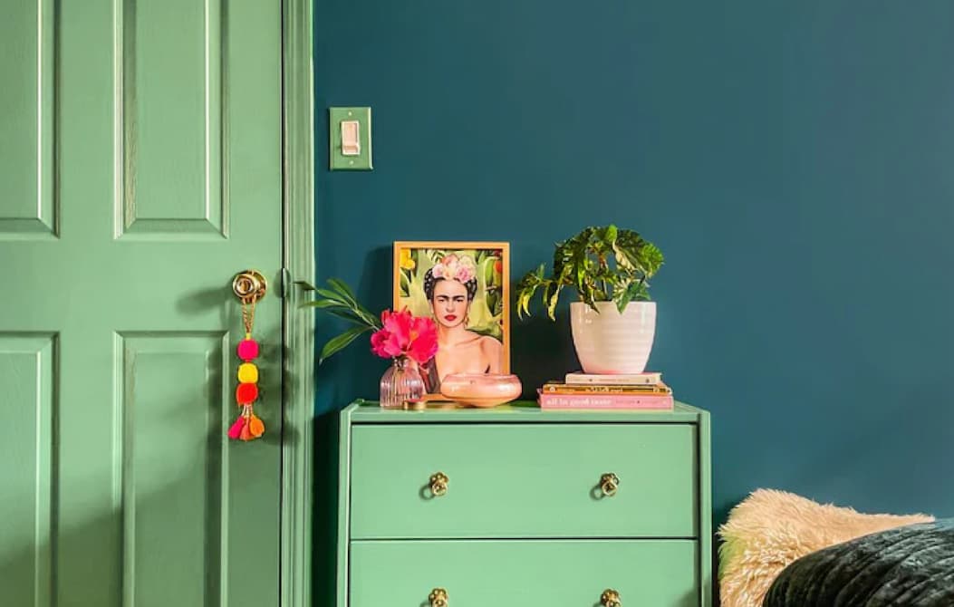 Room featuring door, trim and dresser painted in Matcha Latte and walls painted in Deep Dive