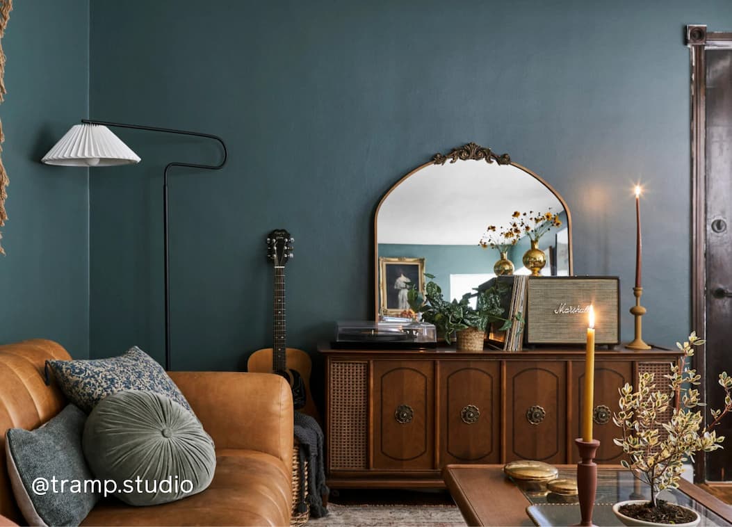 Living room featuring dark green paint color Current Mood Living room featuring dark green paint color Current Mood
