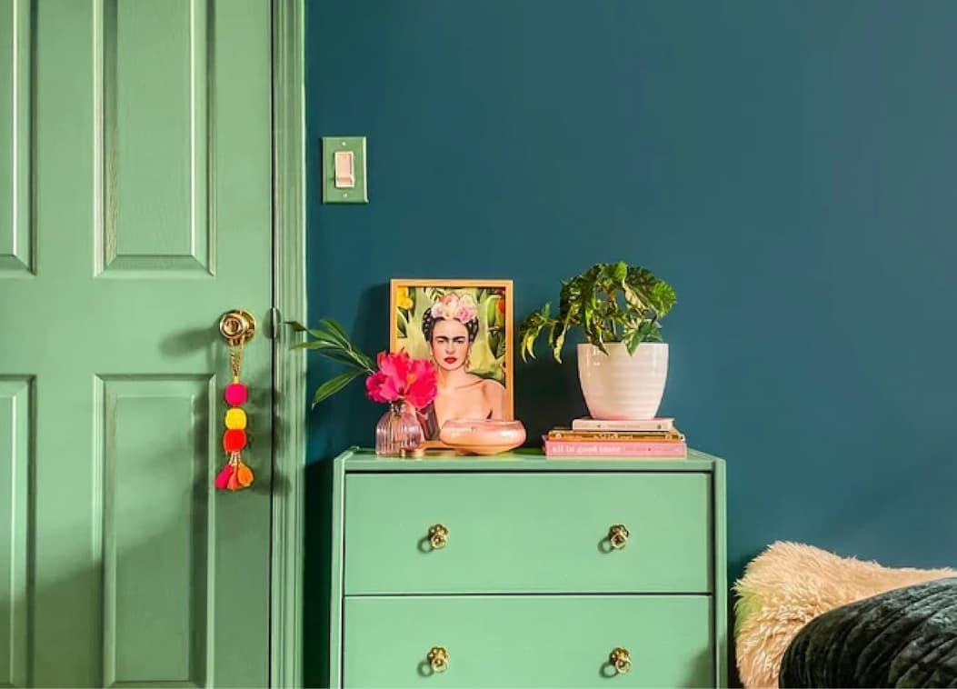 Bedroom featuring painted door and dresser in vibrant green paint color Matcha Latte