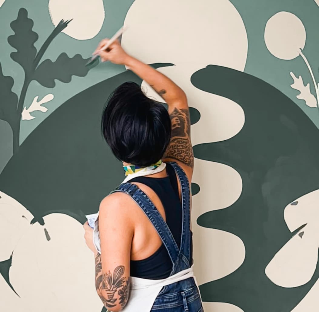 Artist Lauren Hom painting mural in home office featuring Mellow Mood and Current Mood