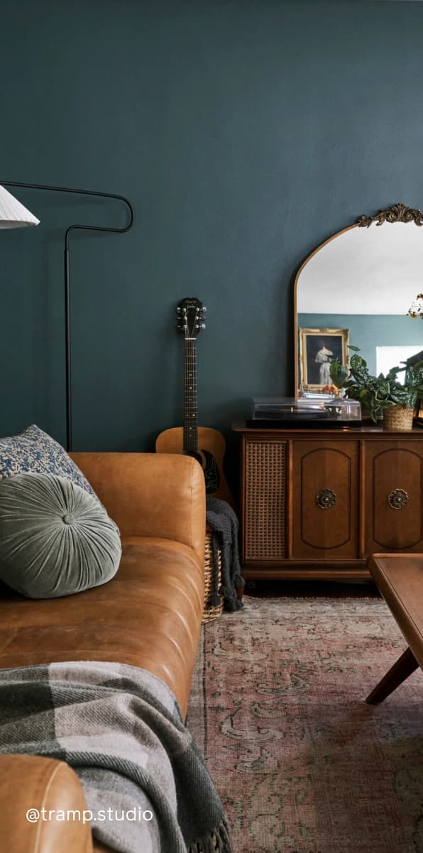 Living room featuring dark green paint color Current Mood