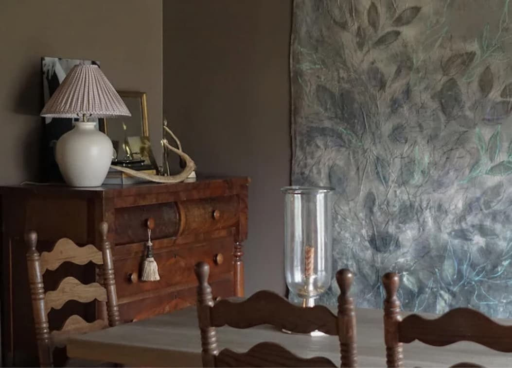 Dining room featuring warm brown paint color Dirty Chai