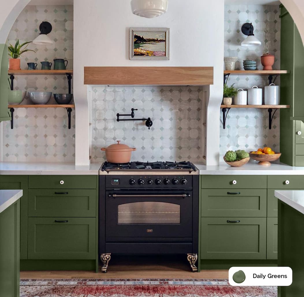 Kitchen featuring forest green cabinets painted with Clare Daily Greens