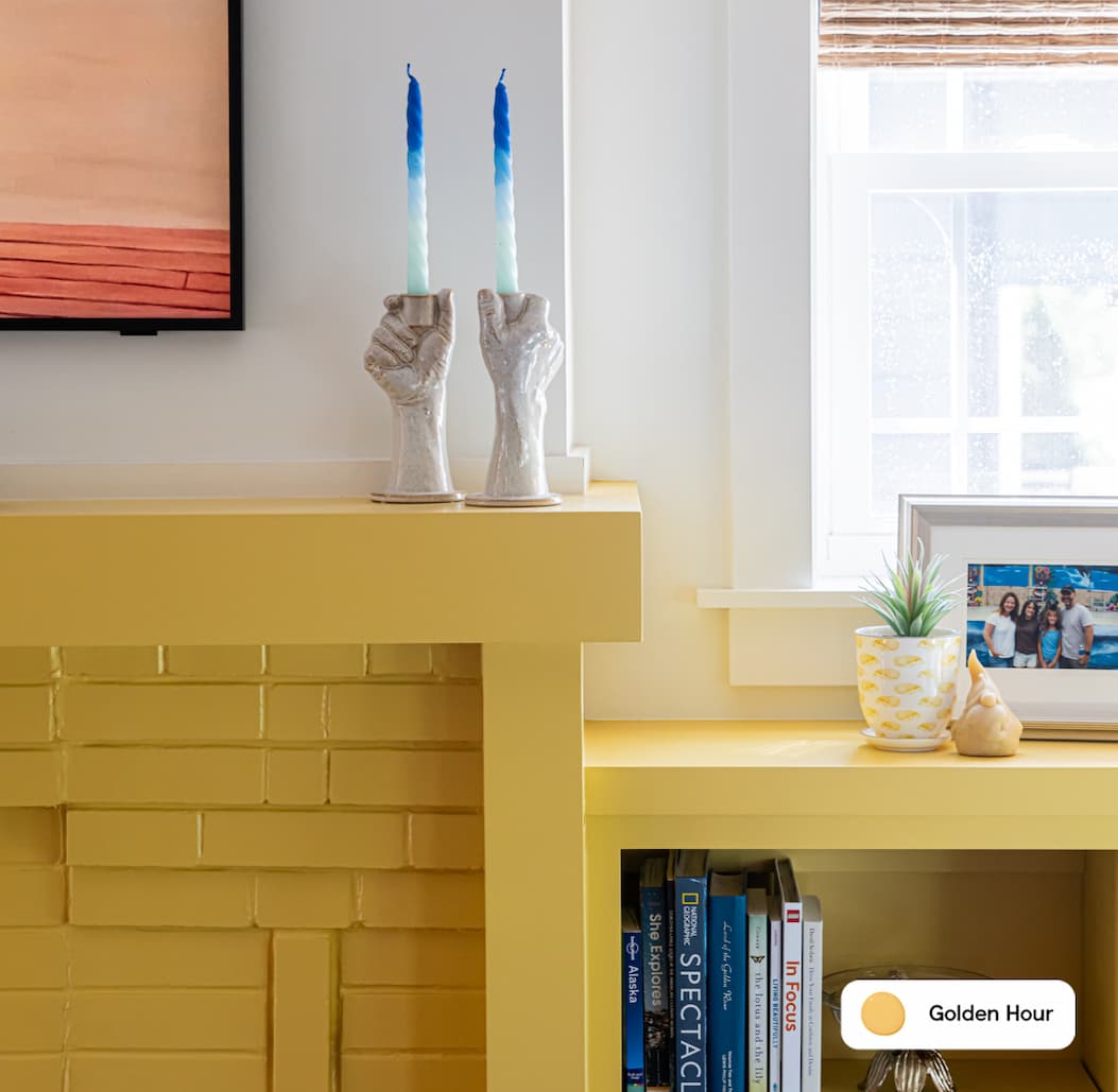 Living room featuring painted fireplace and built-ins in sunny yellow paint color Golden Hour