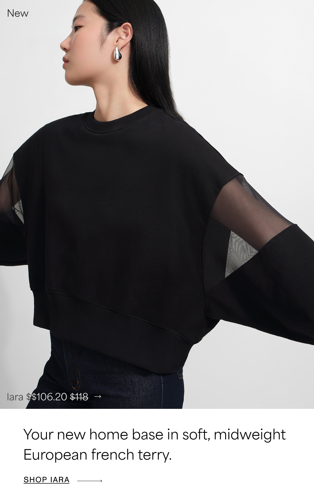 Xun wears a black Iara Sweatshirt with sheer mesh sleeve panels and dark jeans while posing in profile against a white background, with text reading “Relaxed, not retired.” and “New,” priced at $106.20, originally $118. SHOP IARA →