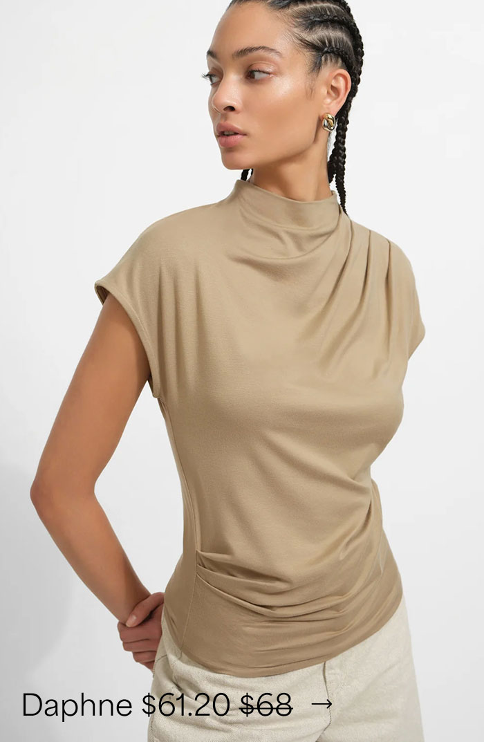 Aliza wears a sand Daphne Top with a softly draped high neckline and gathered waist, priced at $61.20, originally $68.