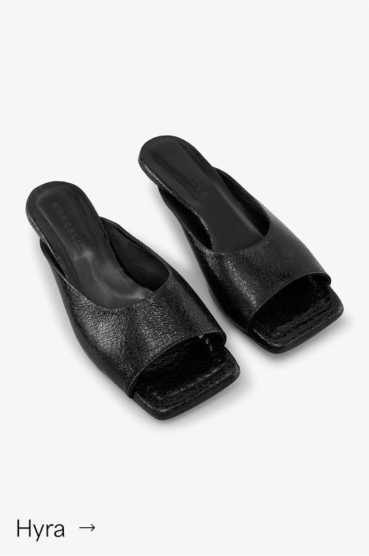 Black Hyra Sandal in Onyx with an open square toe and wedge heel.