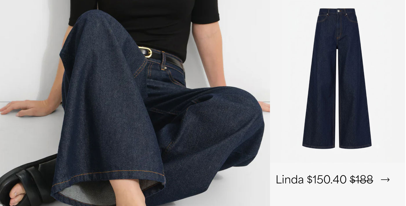 The Linda Jeans feature a high-rise waist, warm contrast stitching, and dramatically wide legs for $150.40.