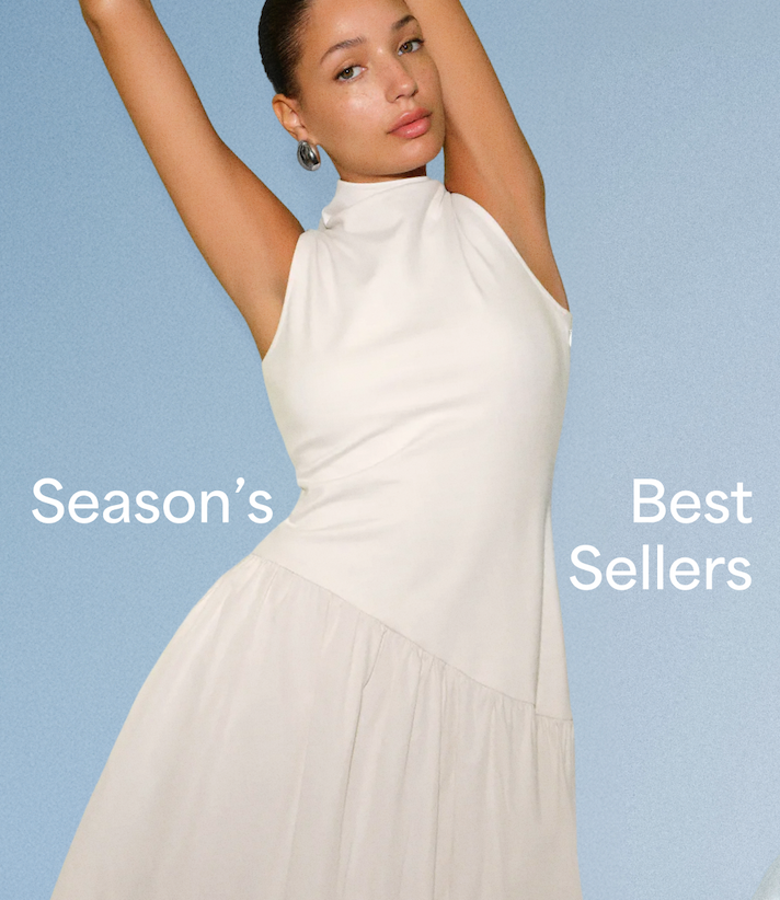 Carmel in a cream Hutton Dress poses against a blue backdrop with the text “Season’s Best Sellers.”