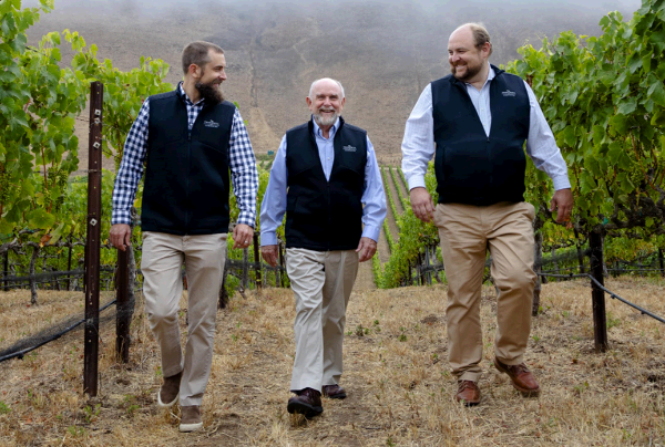 Miller Family, producers of Robles Cabernet Sauvignon 2018 walking in the Robles Cabernet Sauvignon 2018 vineyard.