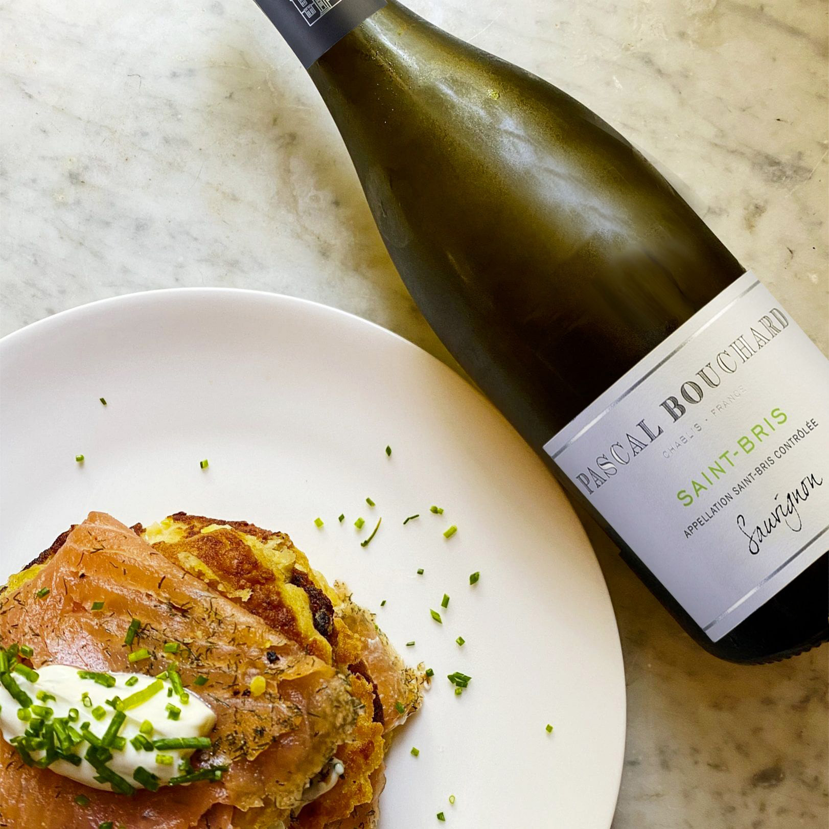 Bottle of Saint-Bris Sauvignon 2020 by Pascal Bouchard on a white marble table.