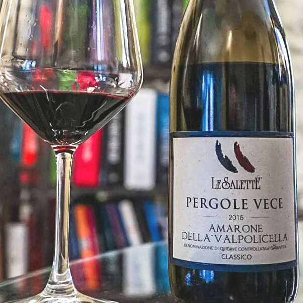 Bottle and glass of Amarone Della Valpolicella Classico DOCG Pergole Vece by Le Salette 2016.
