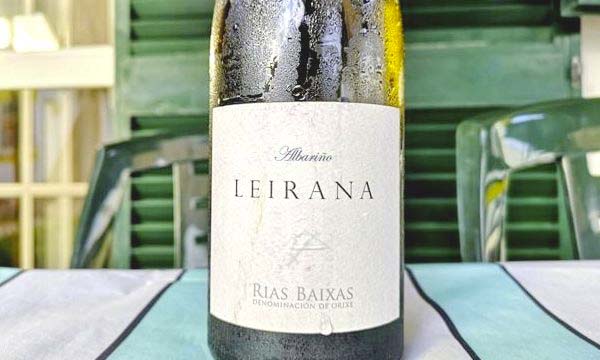 Bottle of Leirana Albariño 2020 by Bodegas Forjas Del Salnés on table.