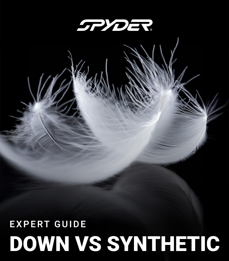 Spyder logo. Photo of down feathers on black background. Message: Expert Guide. Down vs Synthetic