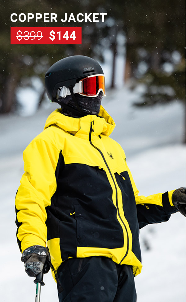 Skier in forest snow conditions wearing a yellow and black ski jacket. Copper Jacket was $399, now $144