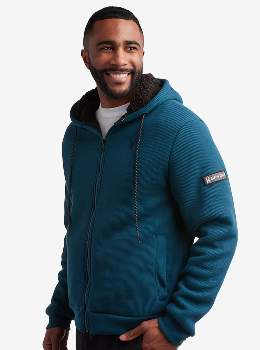 Man wearing full zip hoodie in blue