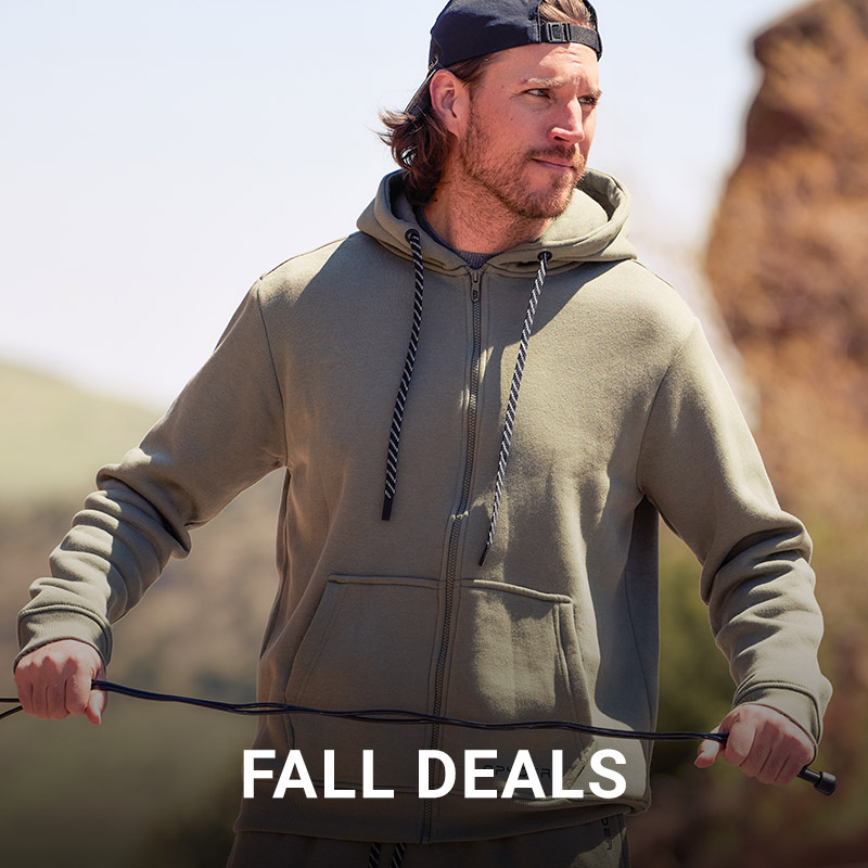 Boy standing in a snow mountain scene with clear goggles wearing a black and red Spyder ski jacket. Message: New Arrivals Shop Boys.