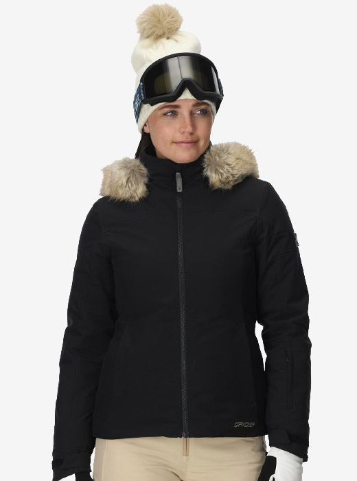 Woman wearing a black ski jacket with faux fur trim on the hood