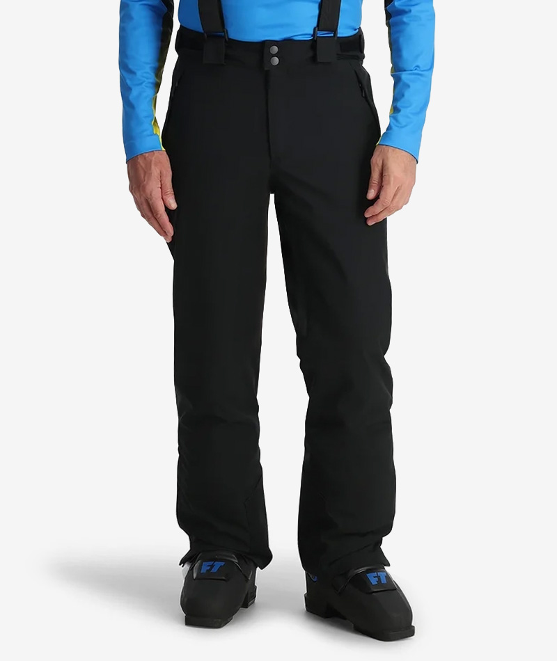 Man wearing black ski pants with suspenders