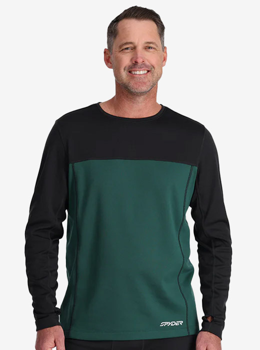 Man in studio wearing a black and green Spyder baselayer with logo