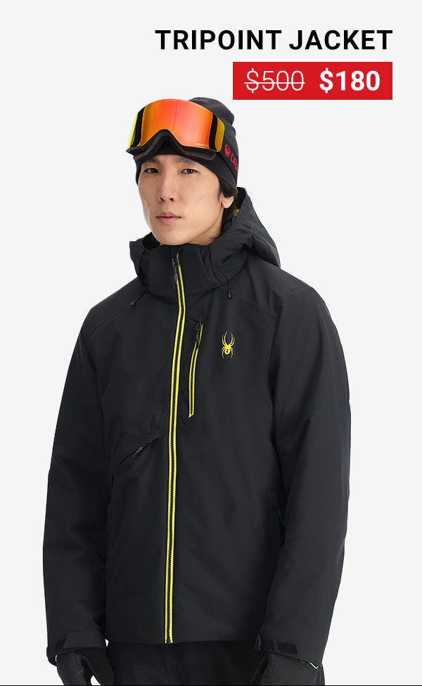 Man standing in a studio wearing a black ski jacket with yellow accents. Tripoint Jacket was $500, now $180