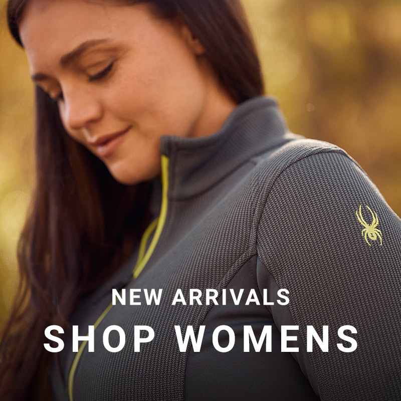 Woman wearing a Spyder textured light jacket with Spyder bug logo. Message: New Arrivals Shop Womens