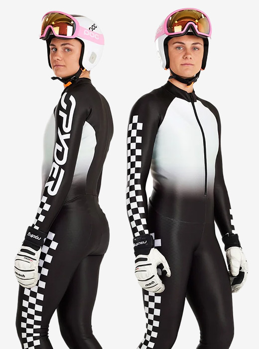 Ski racer in studio wearing a black and white checker suit with Spyder logos